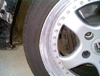 There is a small dent in the rear rim.  I have replaced the tire with what you now see and haven't had any problems.